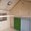 Omlet green automatic chicken coop door and coop light inside wooden chicken coop