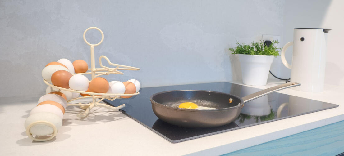 A white Omlet egg skelter full of fresh eggs in a kitchen