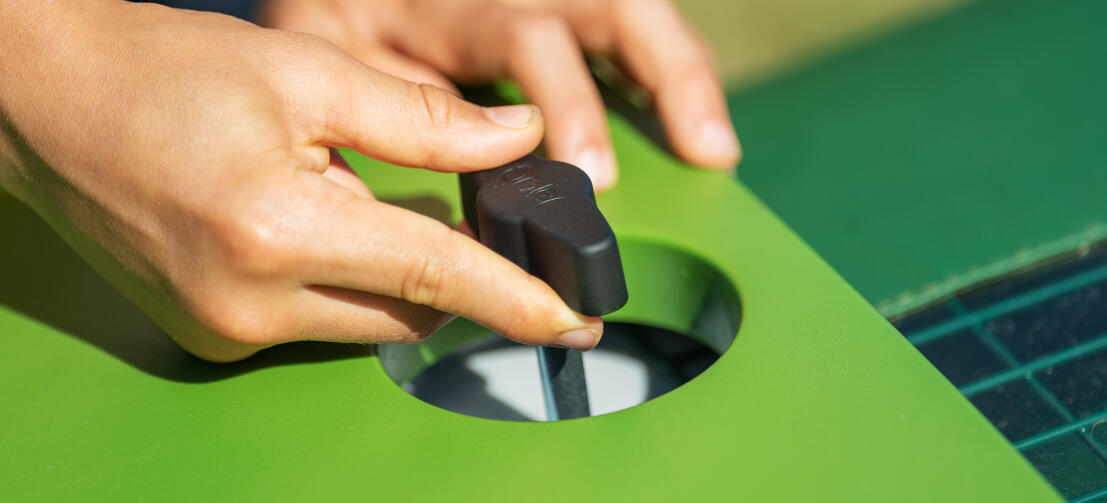 Close up of hands twisting the front door handle open.