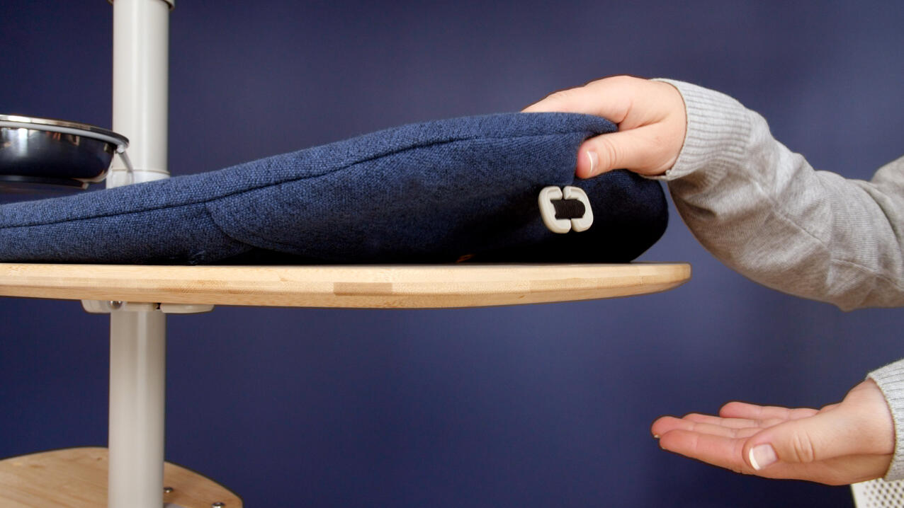 Hands showing the underside of step cushion