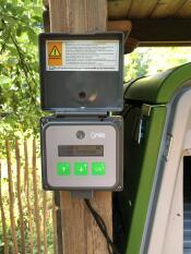 The Omlet automatic chicken coop door opener control panel.