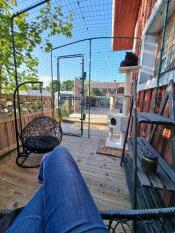 A person sitting in a large catio