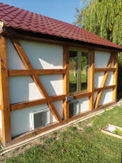 2 grey automatic coop doors on a large coop