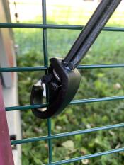 A bungy cord of a mesh panel from a cover