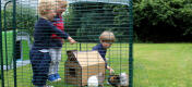 The low enclosure is high enough for small children to stand upright in it