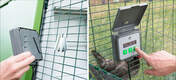 An Autodoor control panel being fitted and programmed on the side of an animal run