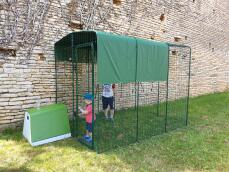 Childen playing the newly installed chicken run.