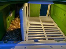 Inside of a large Cube chicken coop