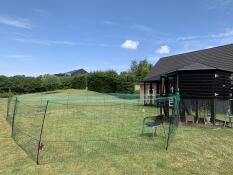 Omlet chicken fencing with some netting on the top.