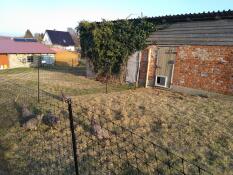 A chicken fence in a garden