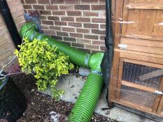 We used a door to connect to both cat flap and hutch then added to t section to Go down to a run on the grass