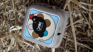 Omlet egg box on a bed of straw
