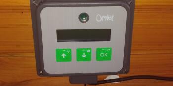 A picture of the Omlet automatic door opener control panel.