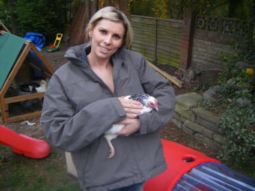 Me with florrie the light sussex bantam about to Go in an Eglu for the first time