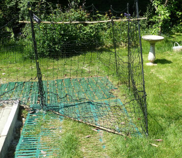 When using the Omlet chicken netting i gave difficulty in pegging down the gate. two pieces of bamboo solve the problem