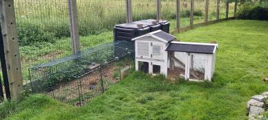 A low rabbit enclosure in a garden