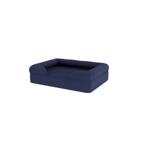 A dark blue memory foam bolster dog bed.