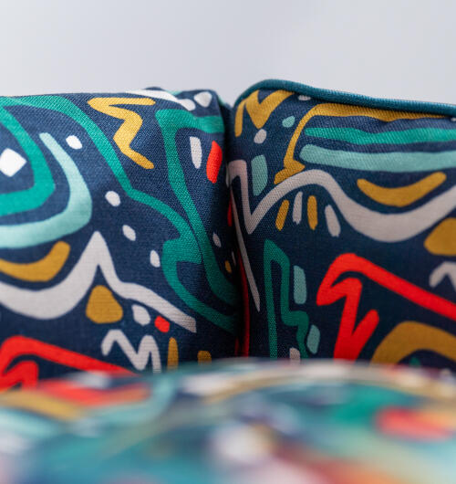 Close up of xoomies print on the nest dog bed