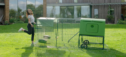 Moving an Eglu Cube chicken coop is easy with run handles