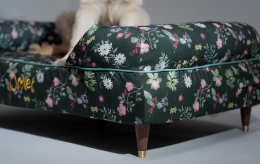 A close up of the midnight meadow bolster dog bed