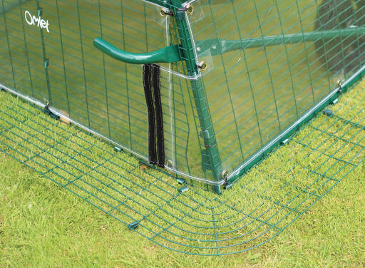 Siply undo the velcro on the Cube windbreak to use the footpedals.