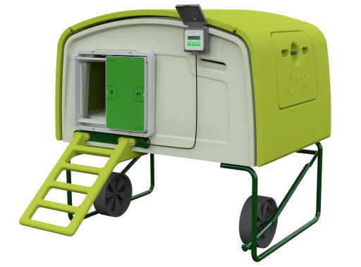 A Autodoor with a control panel on an Eglu Cube large green chicken coop