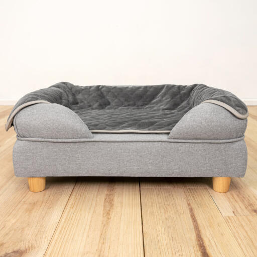 Luxury dog blanket in a bolster memory foam dog bed