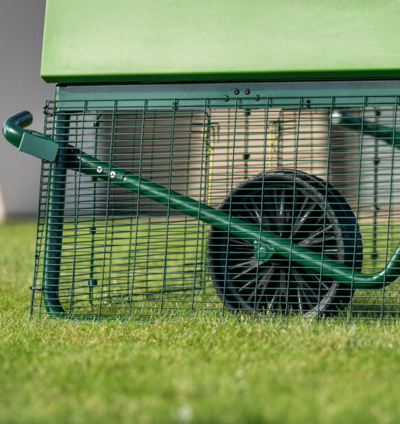 close up of the eglu pro large chicken coop run with wheels for easy manouver