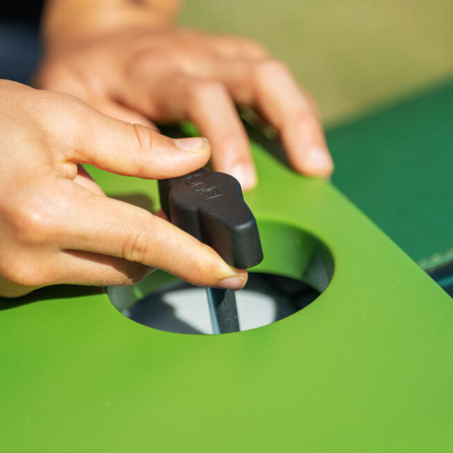 Close up of hands twisting the front door handle open.