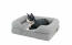 Cat laying on grey bolster bed for cats Cat laying on grey bolster bed for cats