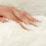 A women stroking a soft cat bed. A women stroking a soft cat bed.