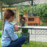 Girl watching rabbit eat treats on Zippi platforms from Omlet Caddi treat holder inside of Zippi rabbit playpen with Zippi tunnel connected Girl watching rabbit eat treats on Zippi platforms from Omlet Caddi treat holder inside of Zippi rabbit playpen with Zippi tunnel connected