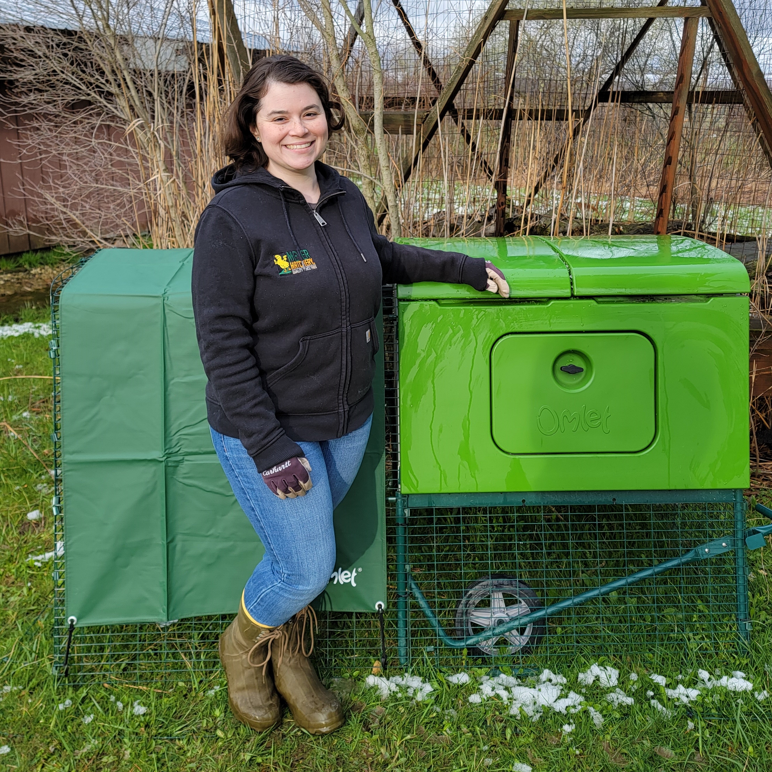 Woman next to the eglu cube chicken coop